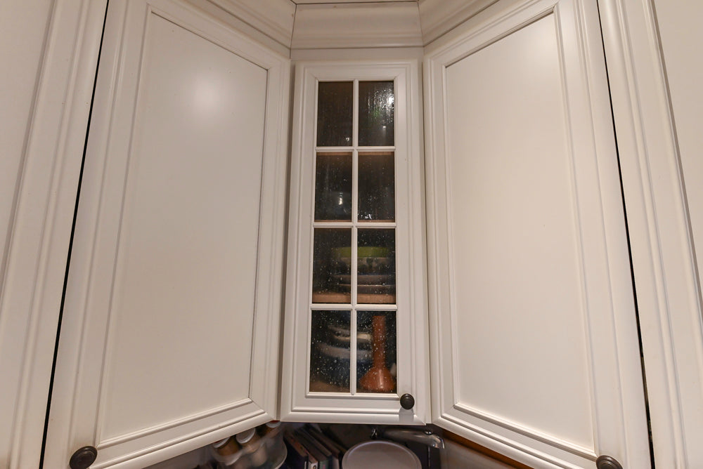 Candelight Traditional Off White Kitchen with Island and Monogram Appliances