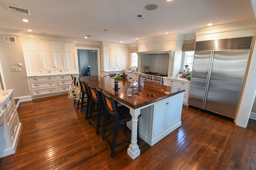 Plain & Fancy traditional white inset kitchen cabinetry with marble countertops