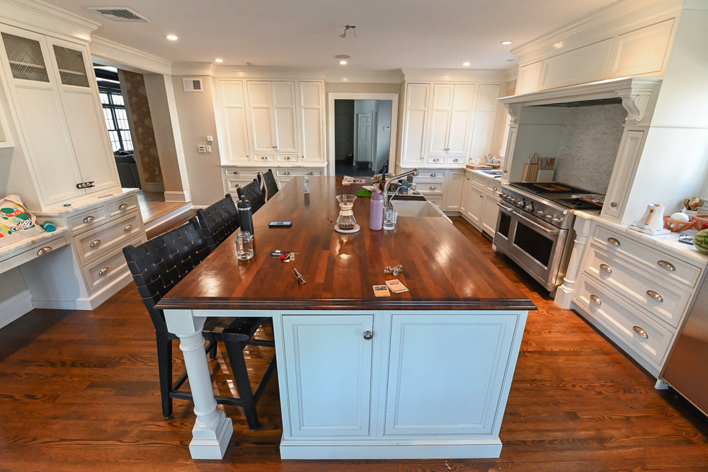 Luxury traditional white kitchen suite featuring integrated professional appliances