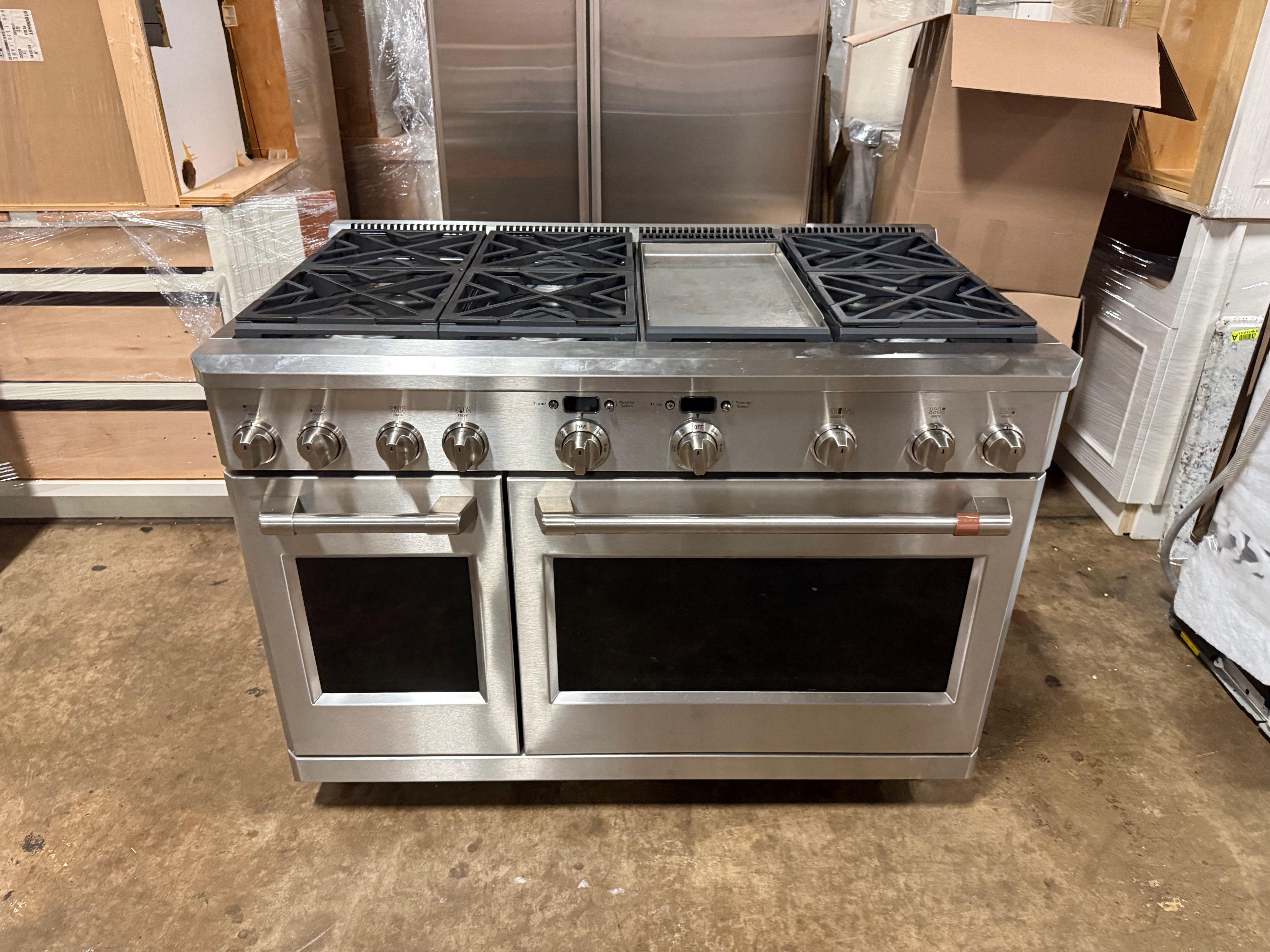 Cafe C2Y486P2MS1 48 inch dual fuel commercial style range with 6 gas burners and center griddle front view