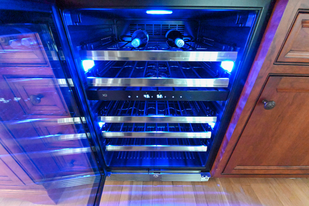 Custom entertainment bar by Plain & Fancy with professional cooling appliances