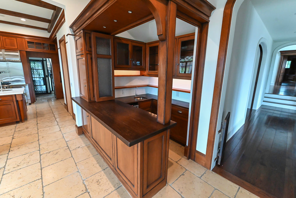 Complete traditional basement bar suite with stone-textured countertops