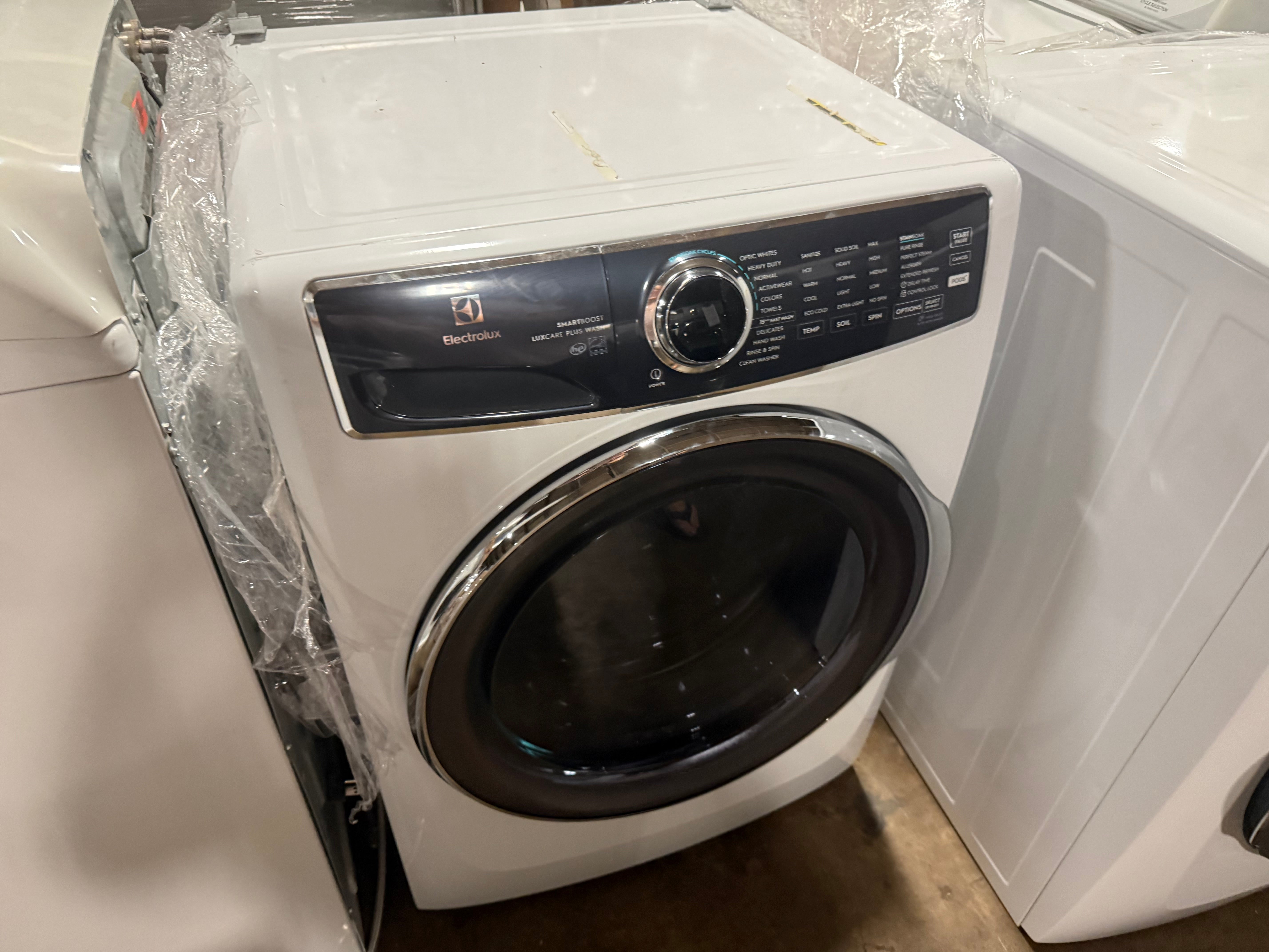 Electrolux front load washing machine with adaptive pod dispenser drawer pulled open