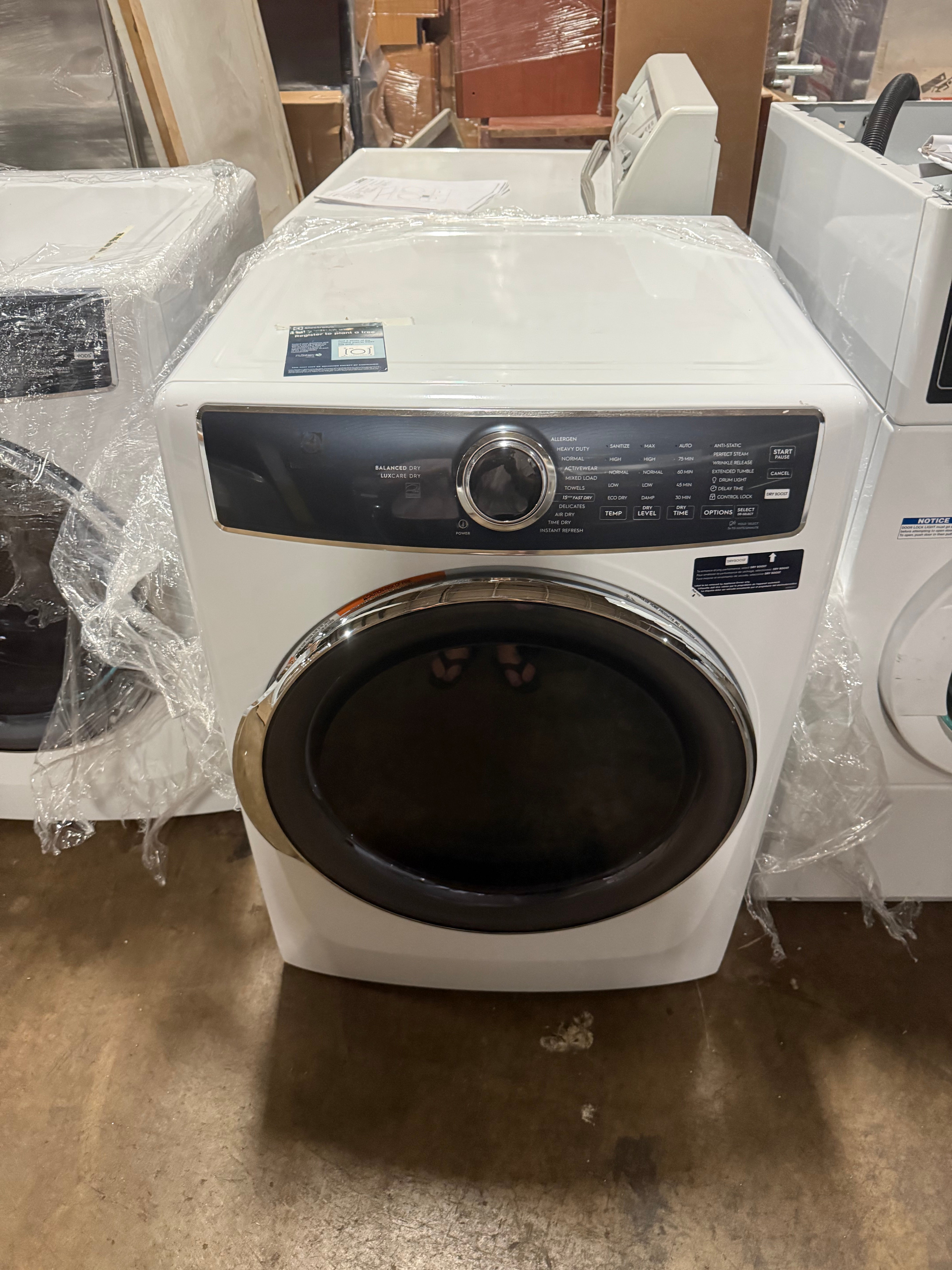 Electrolux 8.0 cubic feet front load electric dryer in white with dark tinted door glass and top electronic control console front view
