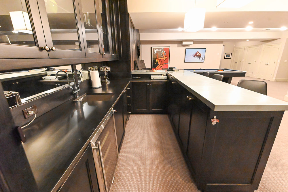 luxury transitional wet bar cabinetry showing open storage shelves and built in fridge