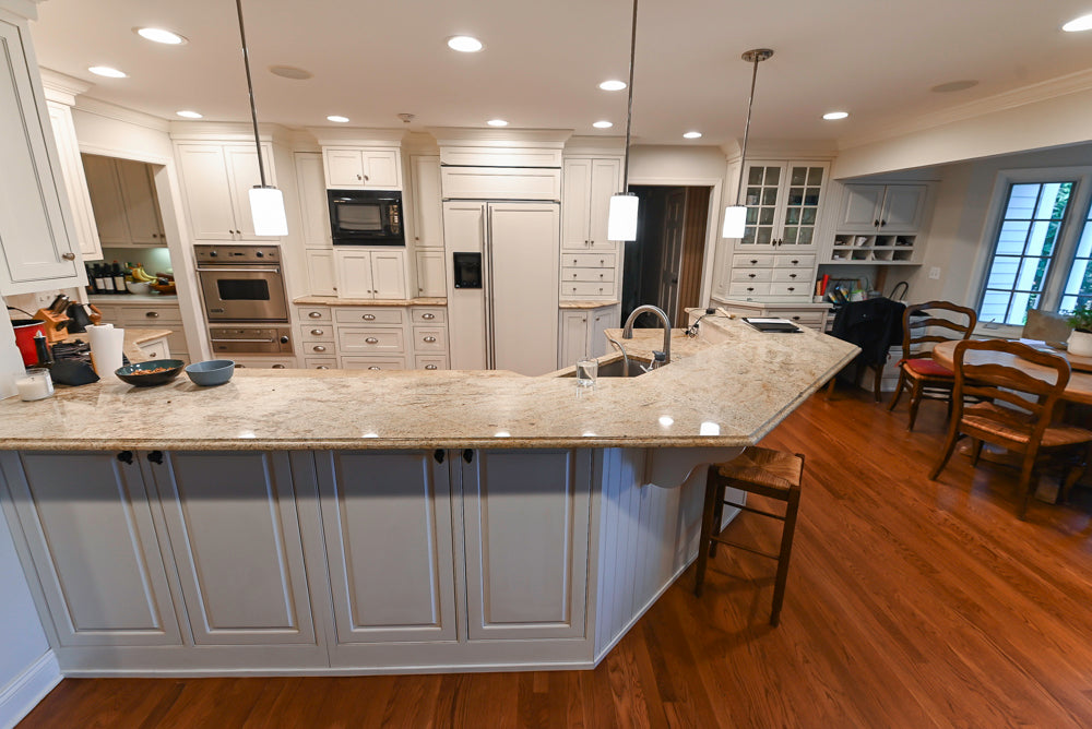 Plain & Fancy White Kitchen with Side Pantry & Appliances