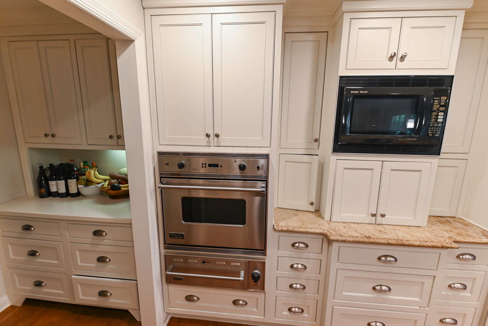 Plain & Fancy White Kitchen with Side Pantry & Appliances