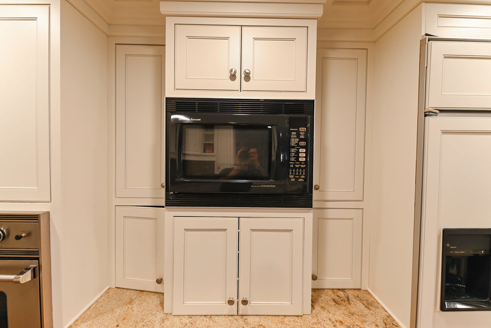 Plain & Fancy White Kitchen with Side Pantry & Appliances