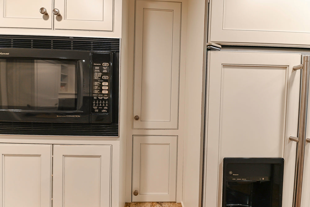 Plain & Fancy White Kitchen with Side Pantry & Appliances