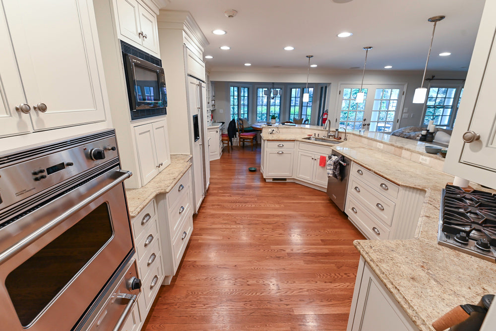 Plain & Fancy White Kitchen with Side Pantry & Appliances