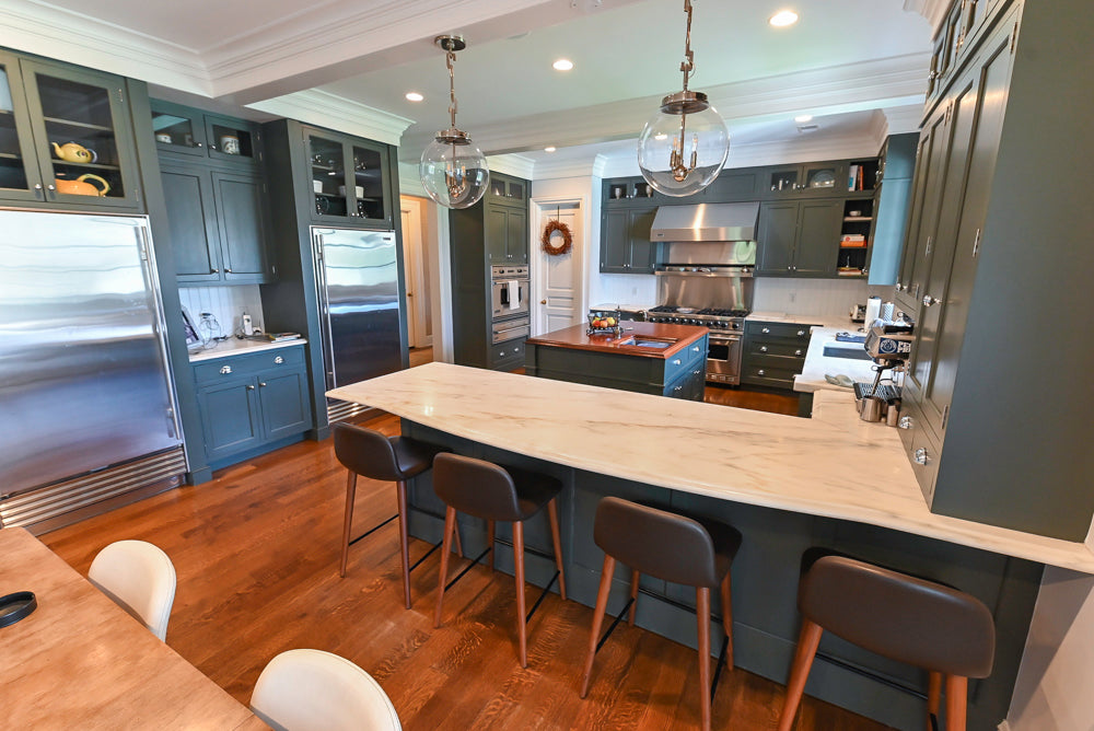 Rutt custom transitional sage green kitchen cabinetry with Sub-Zero and Viking appliances
