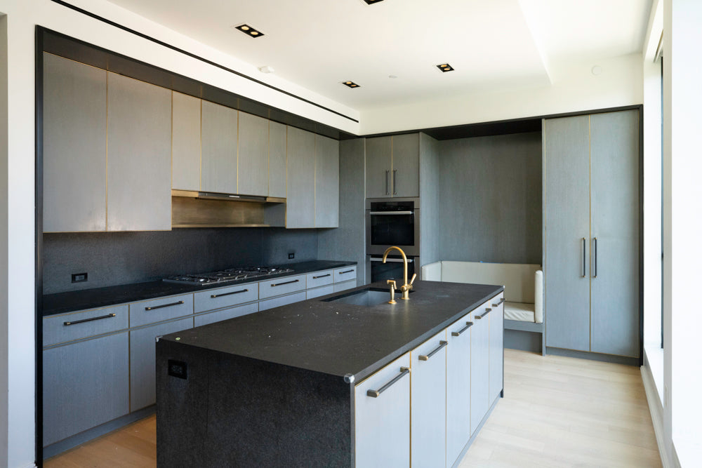 Luxury minimalist grey oak kitchen cabinets open showing integrated premium Miele appliances