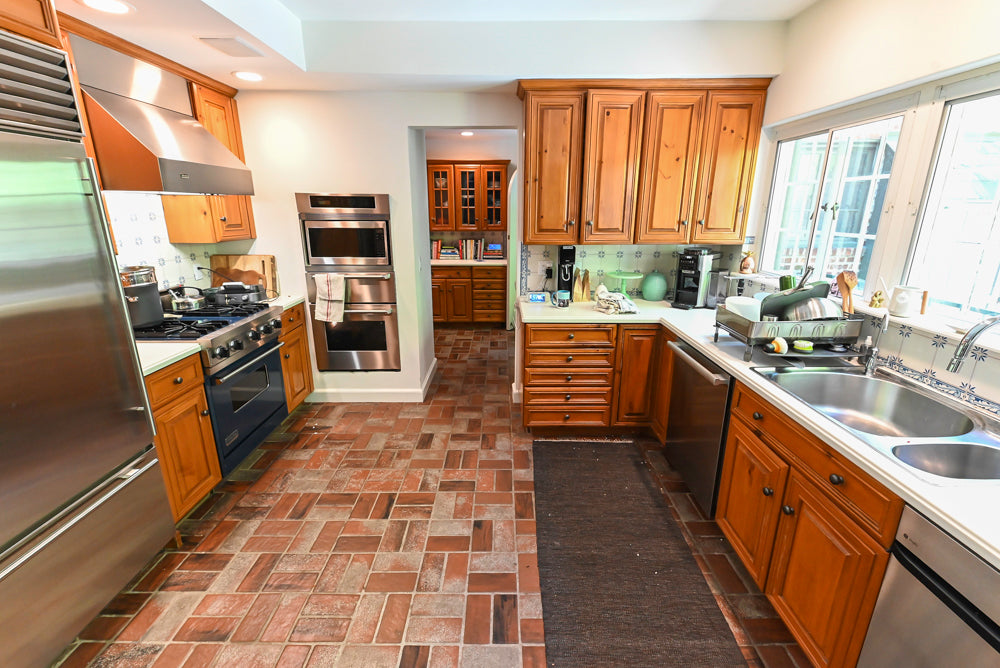 Luxury inset cabinetry kitchen system by Wood-Mode with appliances