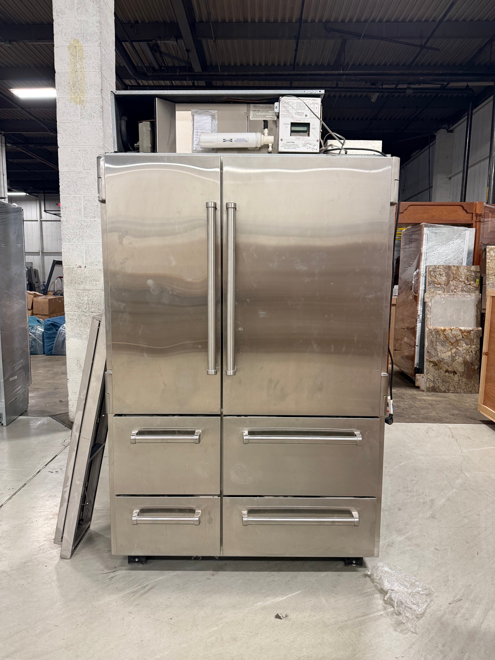 Luxury professional 48 inch stainless steel refrigerator showing robust professional handles close up