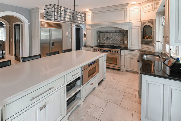 The Abernathy grand off-white traditional kitchen with island and Sub-Zero refrigerator