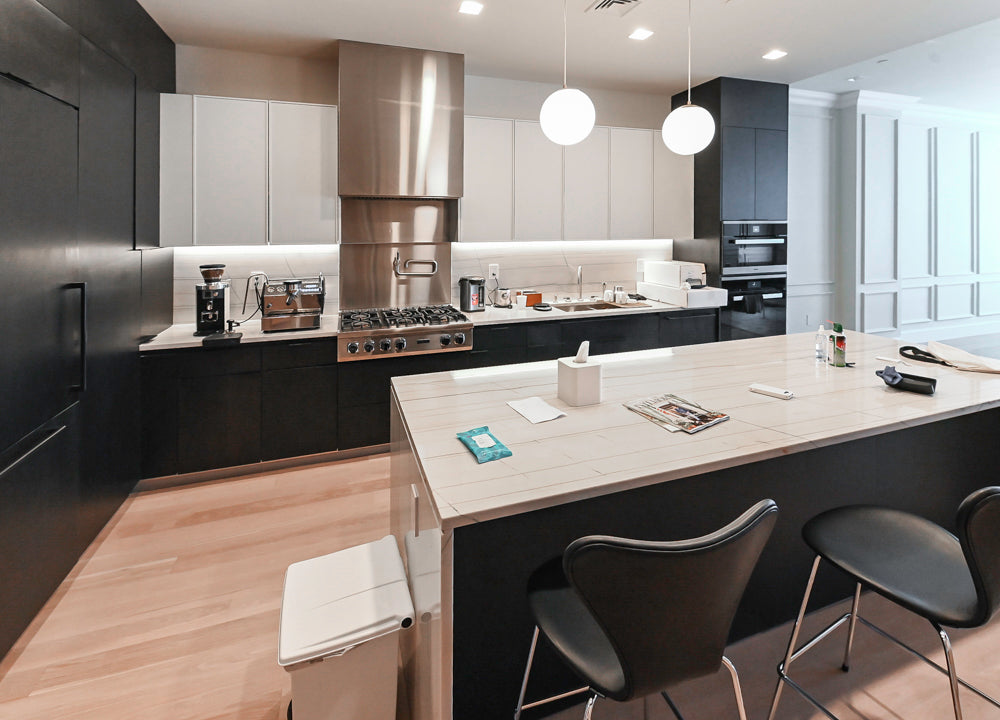 Pre owned Soho luxury kitchen island showing custom base framing built for waterfall edge stone countertops