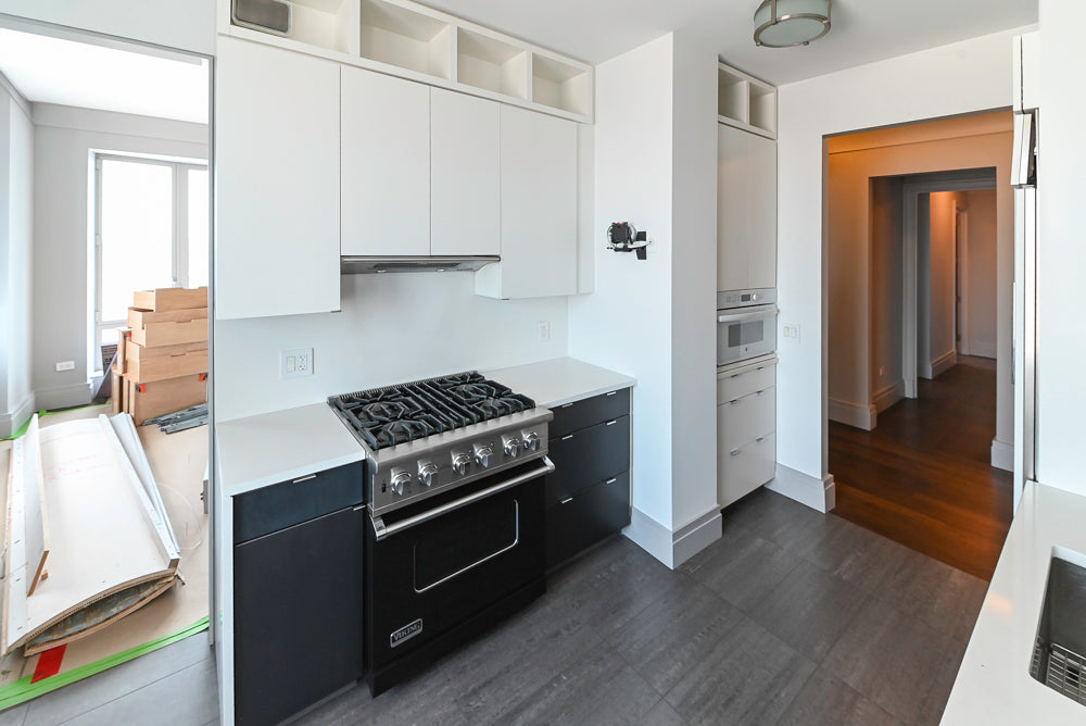 Pre owned Mercer kitchen package detail view showing built in professional refrigerator and column ovens