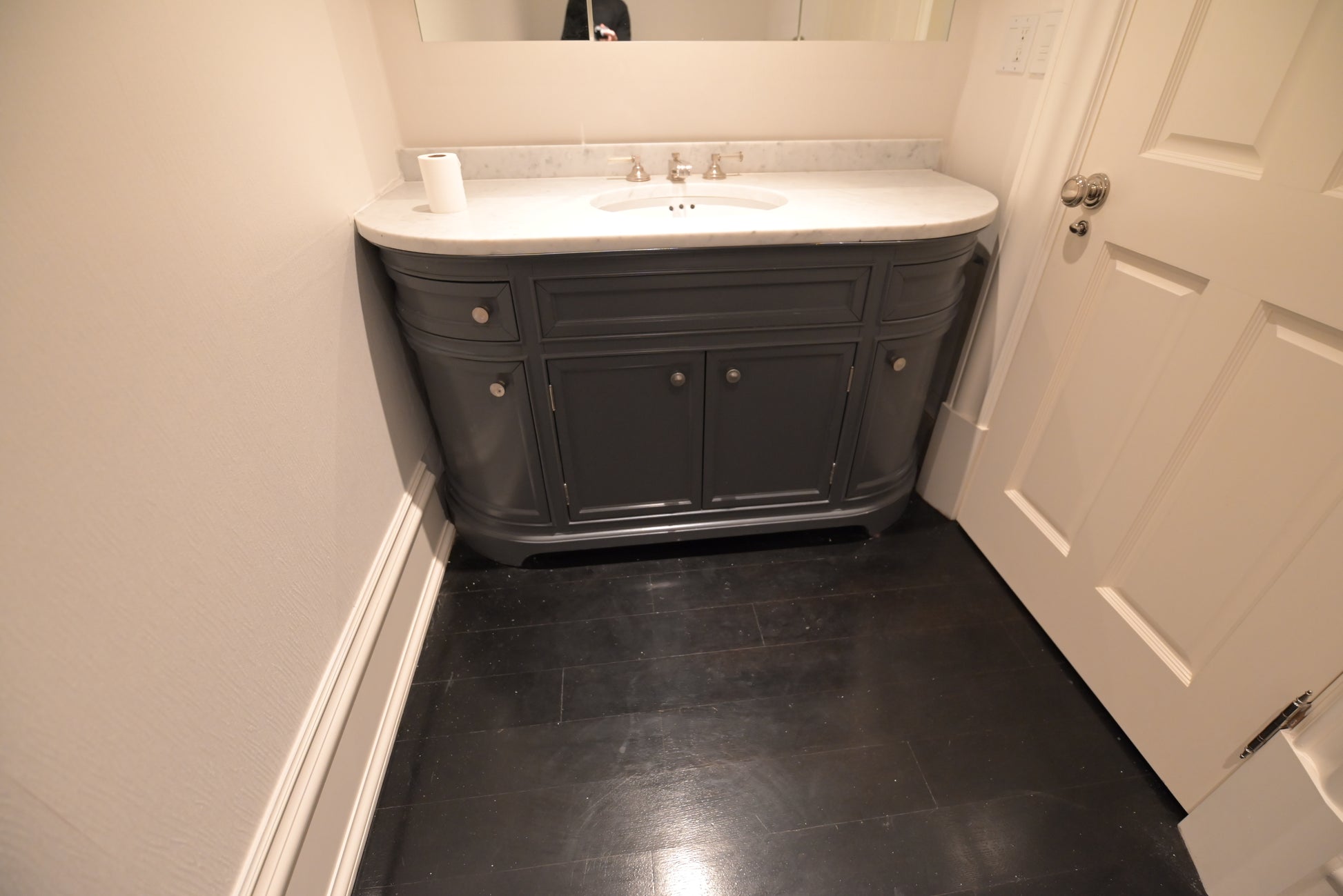 Architectural single-sink vanity in charcoal grey for primary bathroom