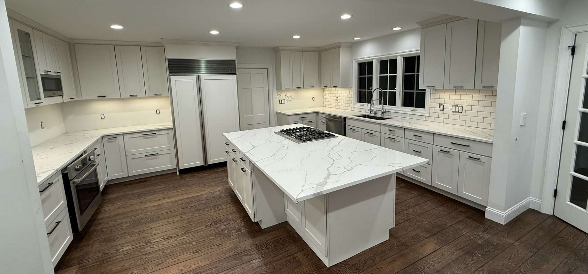 “The Westerly” Transitional White Kitchen with Island, 48" Sub-Zero Refrigerator and Bosch Appliances