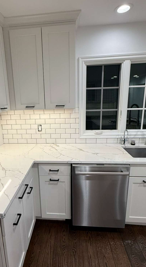 “The Westerly” Transitional White Kitchen with Island, 48" Sub-Zero Refrigerator and Bosch Appliances