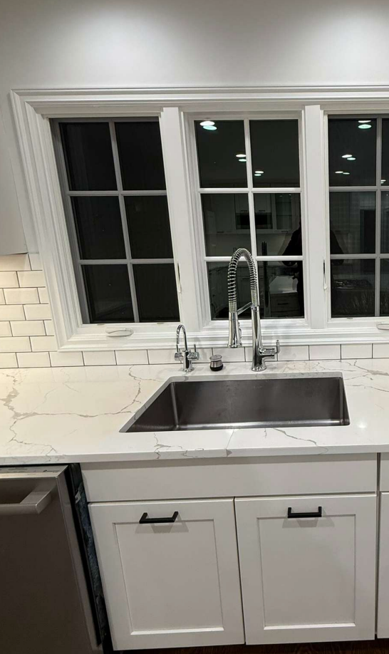 “The Westerly” Transitional White Kitchen with Island, 48" Sub-Zero Refrigerator and Bosch Appliances