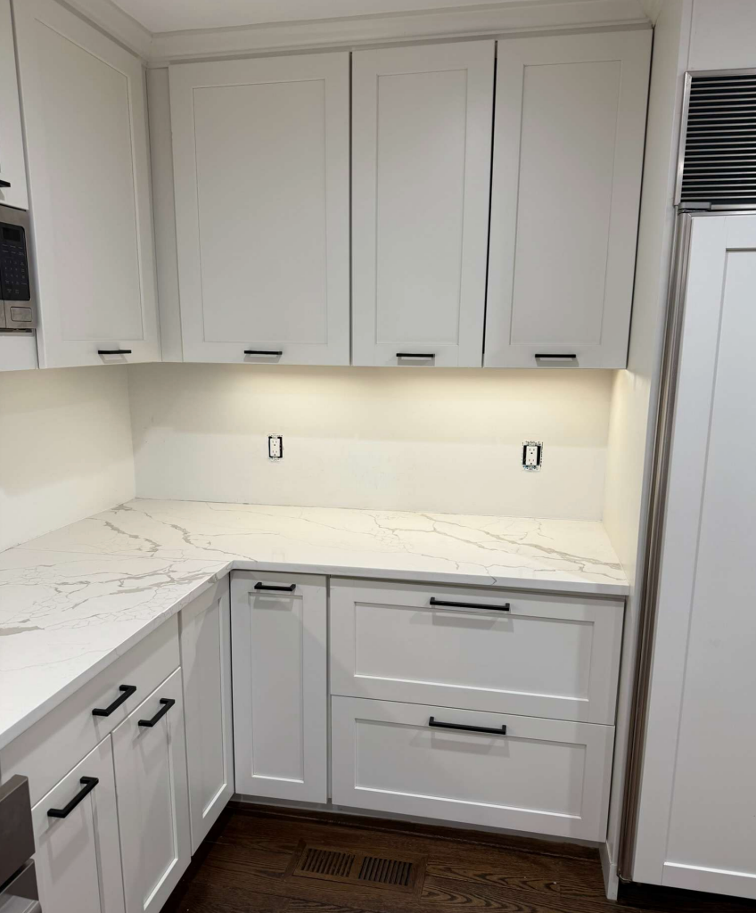 “The Westerly” Transitional White Kitchen with Island, 48" Sub-Zero Refrigerator and Bosch Appliances
