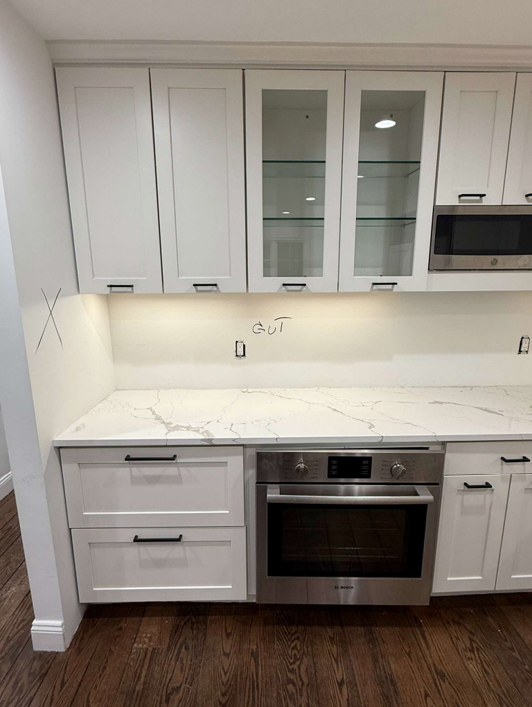 “The Westerly” Transitional White Kitchen with Island, 48" Sub-Zero Refrigerator and Bosch Appliances