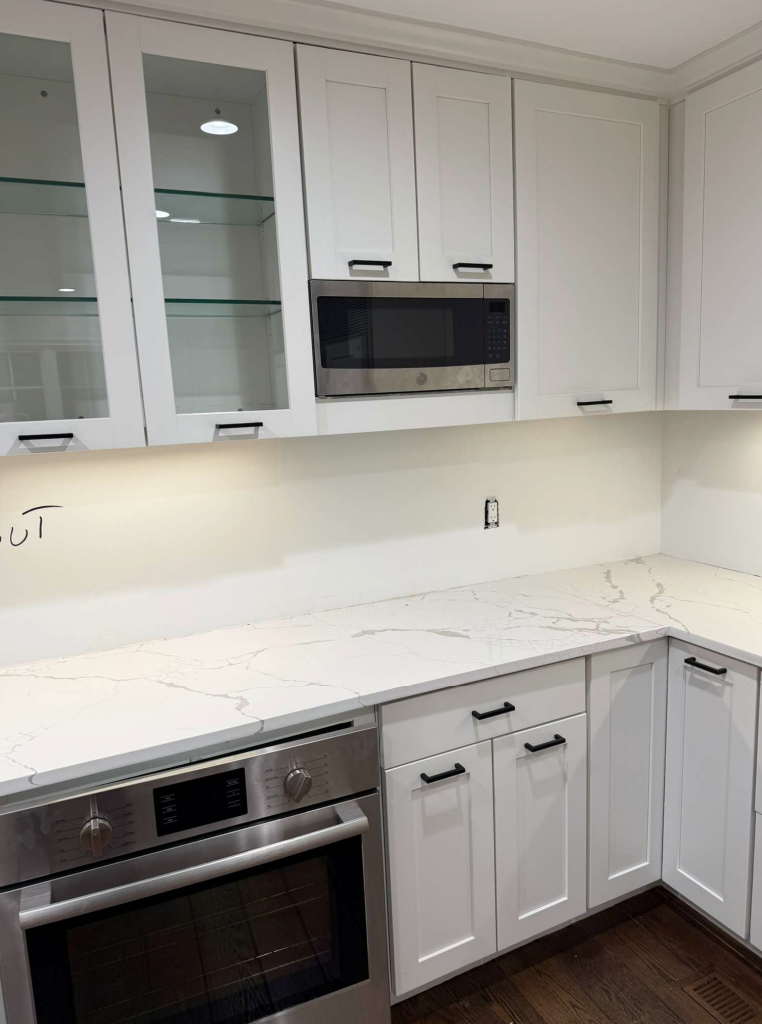 “The Westerly” Transitional White Kitchen with Island, 48" Sub-Zero Refrigerator and Bosch Appliances