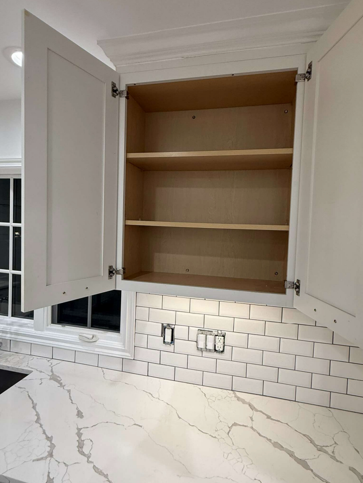 “The Westerly” Transitional White Kitchen with Island, 48" Sub-Zero Refrigerator and Bosch Appliances