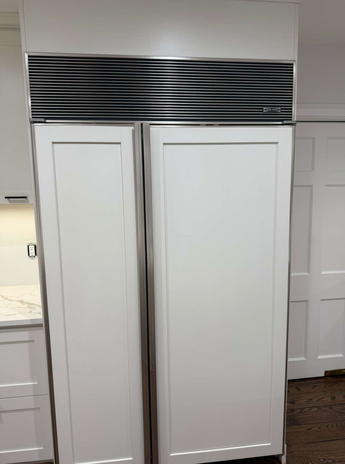 “The Westerly” Transitional White Kitchen with Island, 48" Sub-Zero Refrigerator and Bosch Appliances