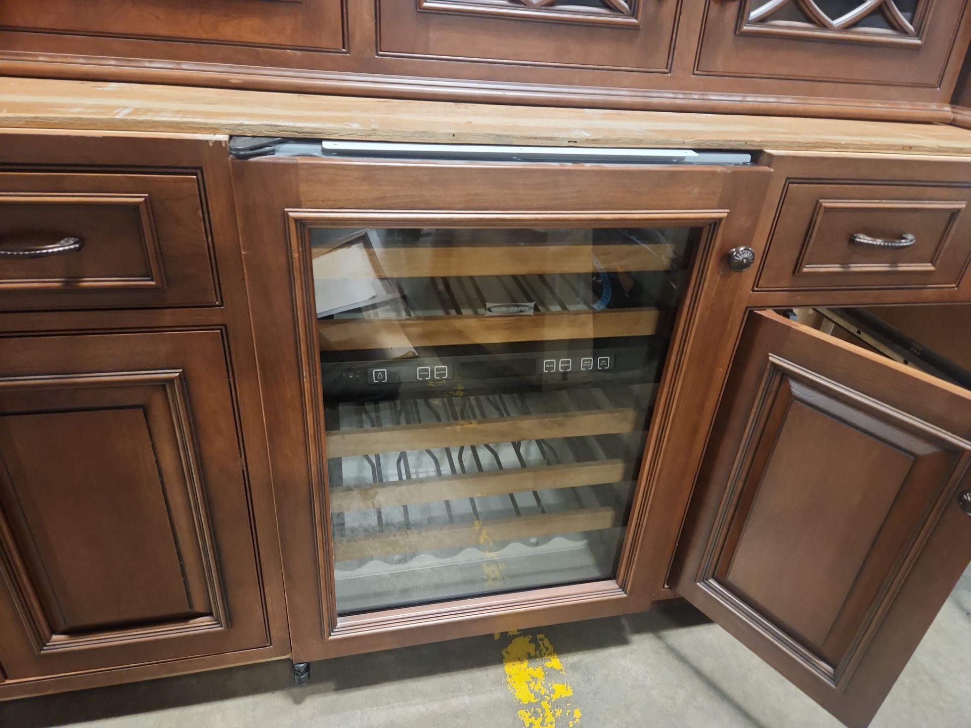 “The Reserve” Custom Traditional Wood Butler's Pantry with Sub-Zero Wine Cooler