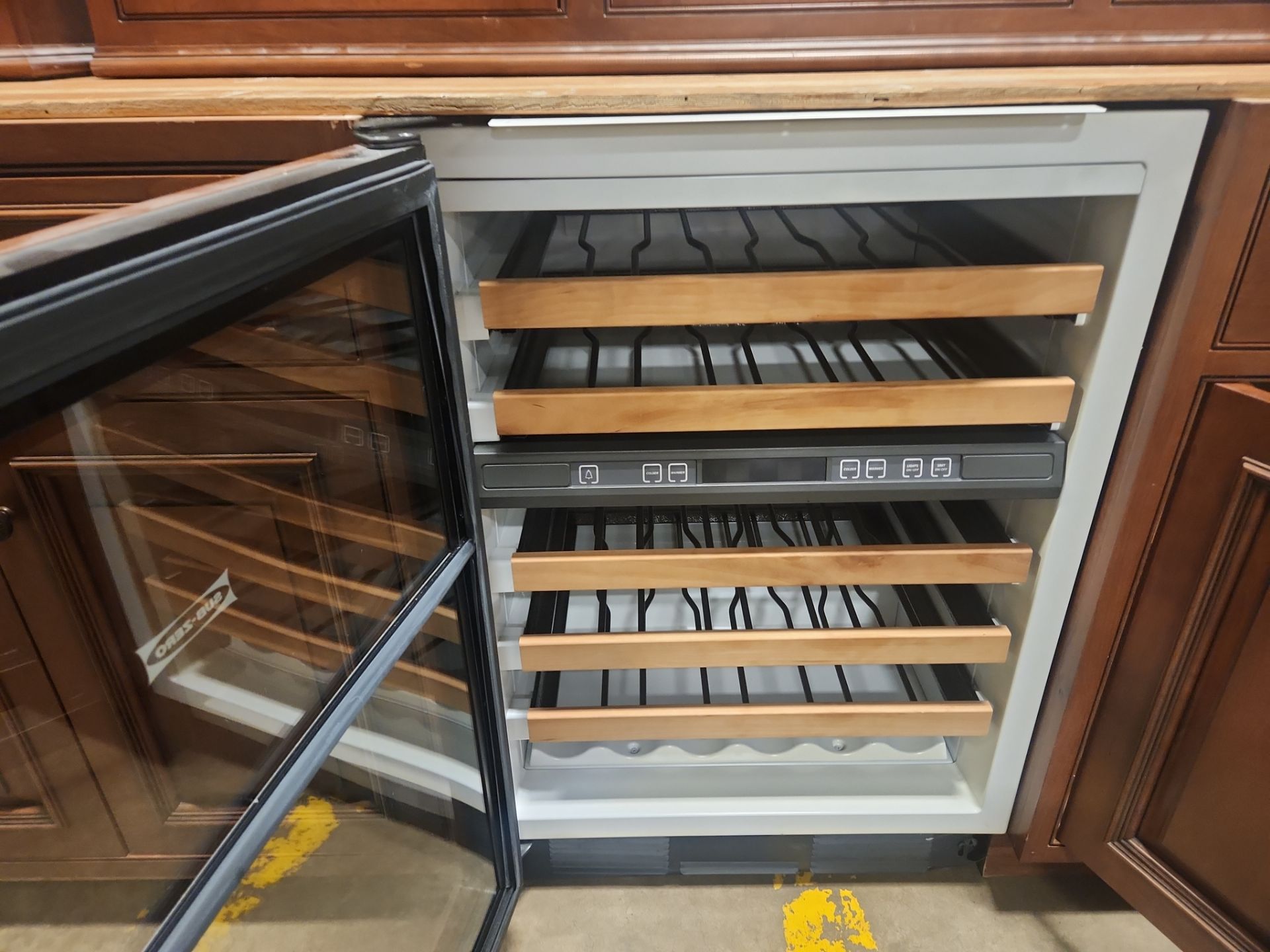 “The Reserve” Custom Traditional Wood Butler's Pantry with Sub-Zero Wine Cooler