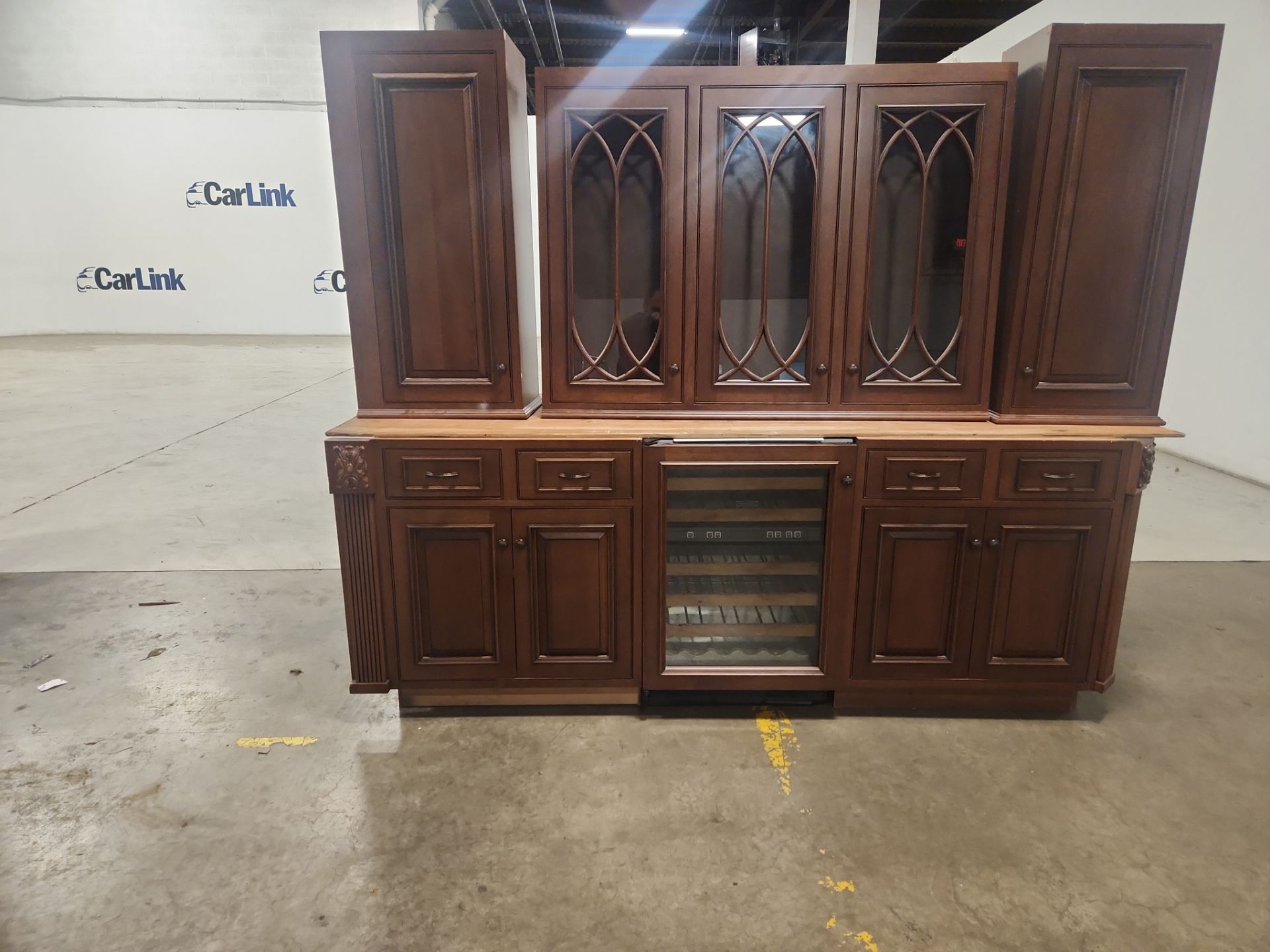 Classic butler's station with Sub-Zero refrigeration and natural wood finish