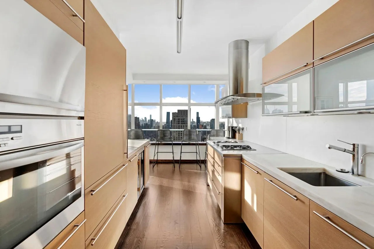 Poggenpohl Modern Light Wood Veneer Kitchen with White Marble Countertops and Appliances