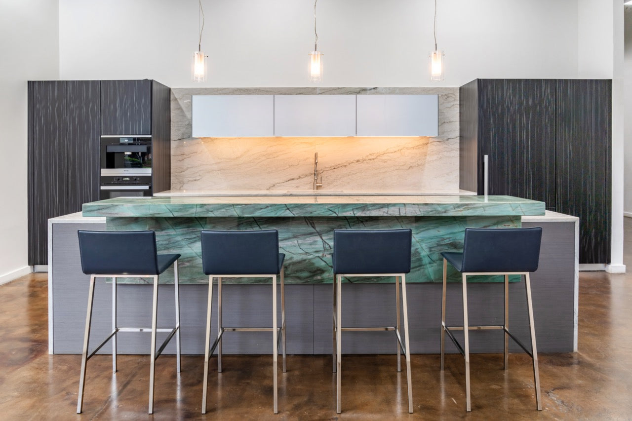 Modern floor-to-ceiling kitchen display with waterfall island by eggersmann