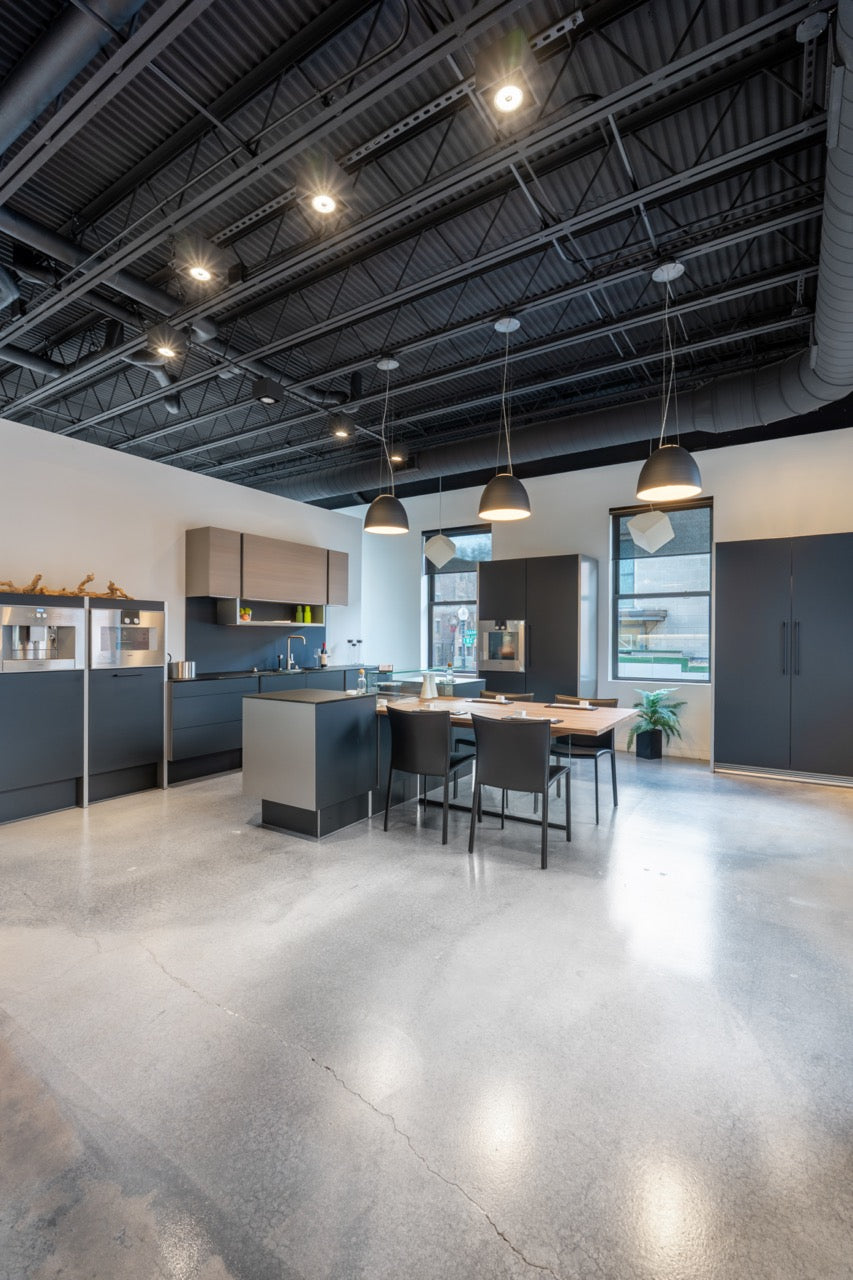 Poggenpohl Porsche Modern Matte Grey Kitchen with Wood Top Seating Area and Gaggenau Appliances