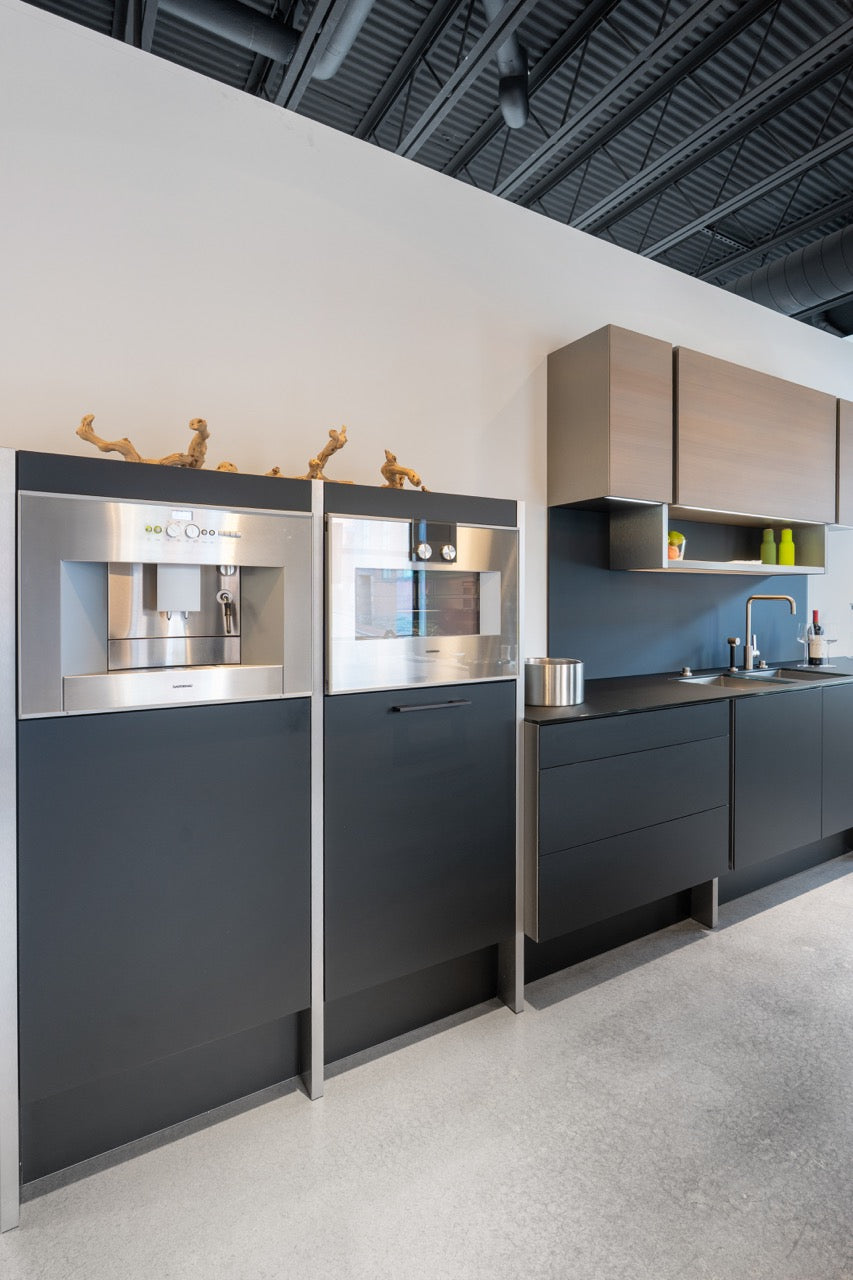 Poggenpohl Porsche Modern Matte Grey Kitchen with Wood Top Seating Area and Gaggenau Appliances