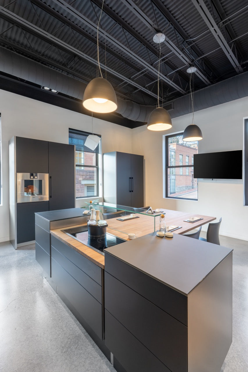 Poggenpohl Porsche Modern Matte Grey Kitchen with Wood Top Seating Area and Gaggenau Appliances