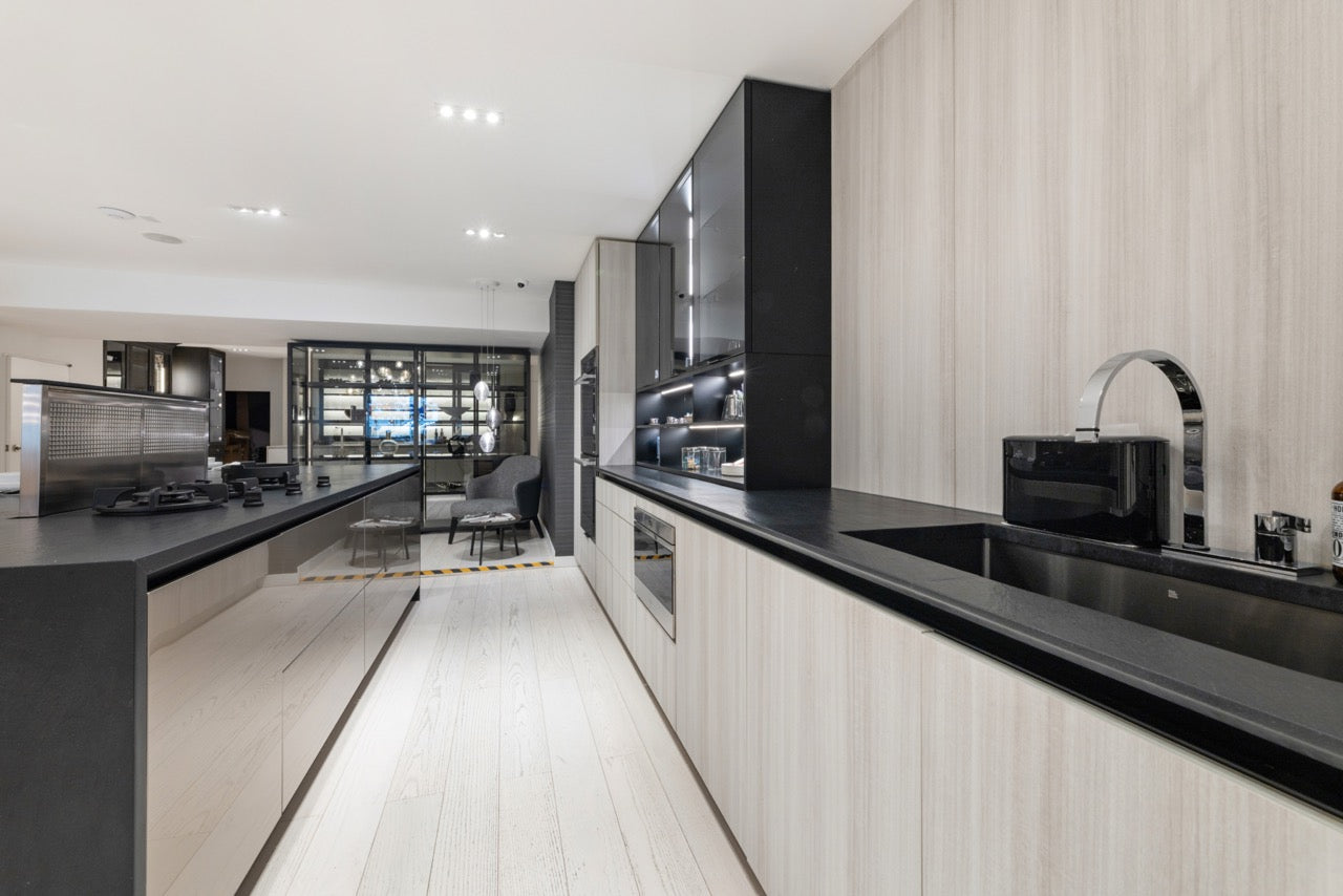 DOCA modern kitchen layout showing integrated appliances and side pantry storage