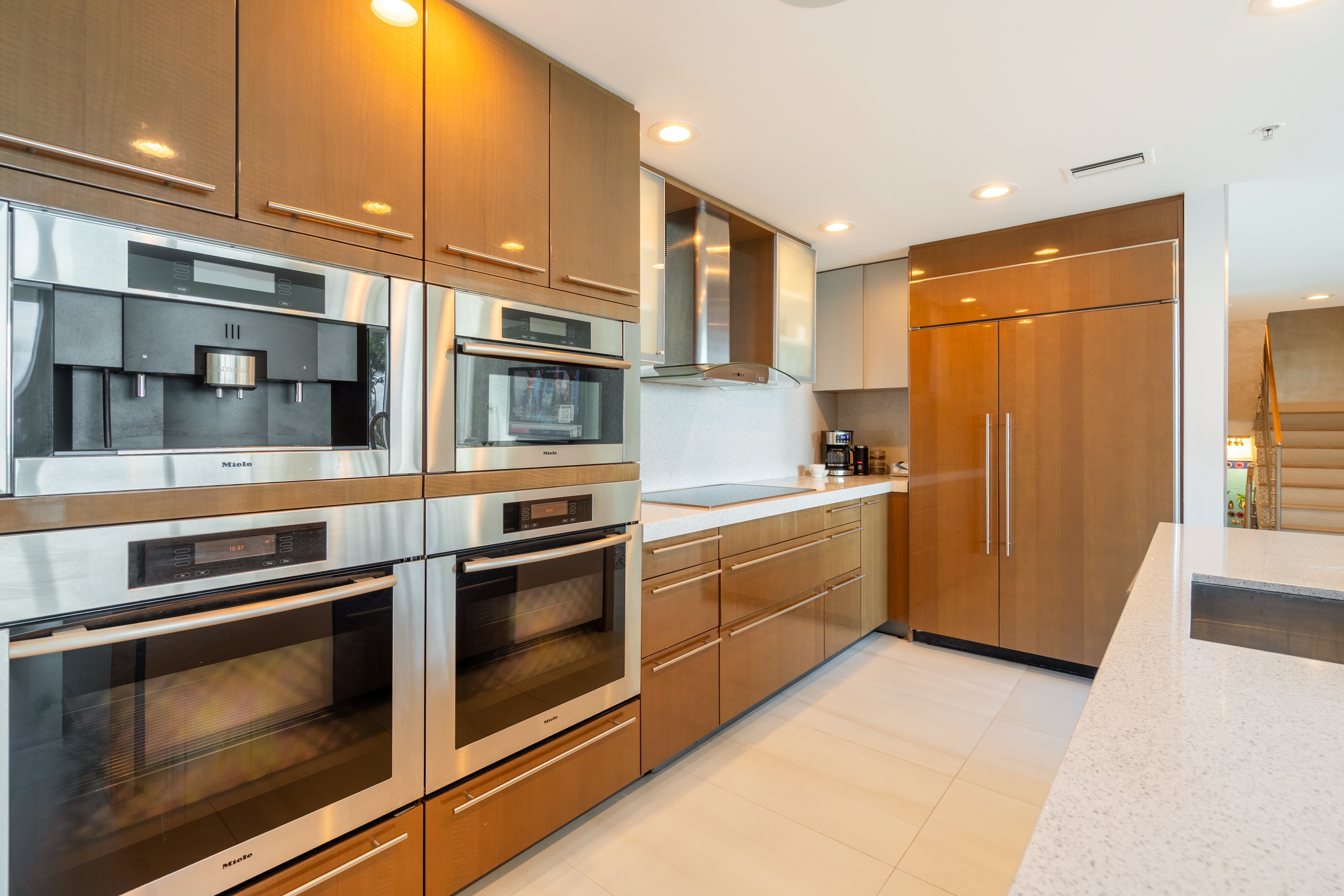 High-end German kitchen suite by Poggenpohl featuring integrated Miele technology