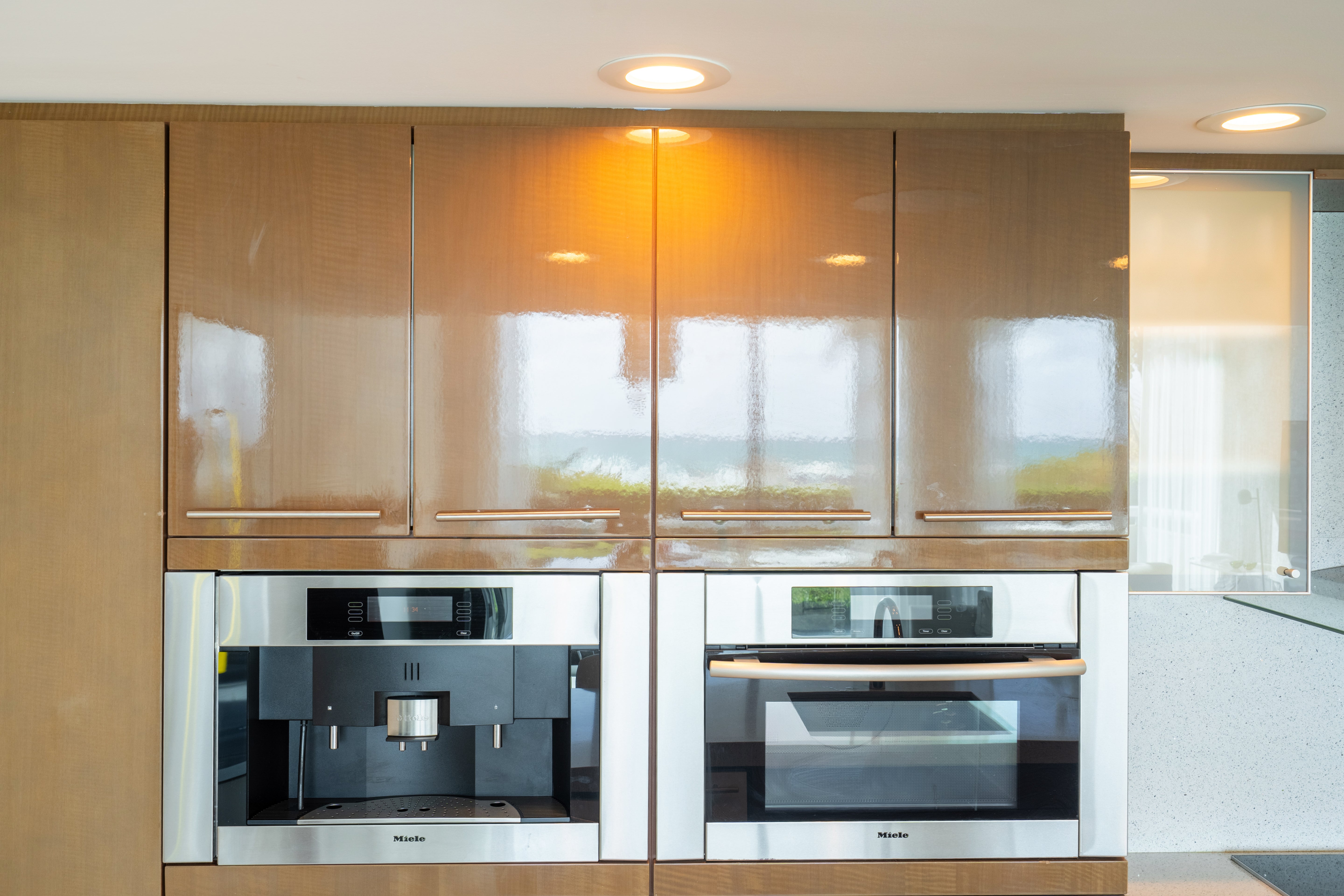 Poggenpohl Modern Glossy Exotic Wood Veneer Kitchen with Island & Miele Appliances