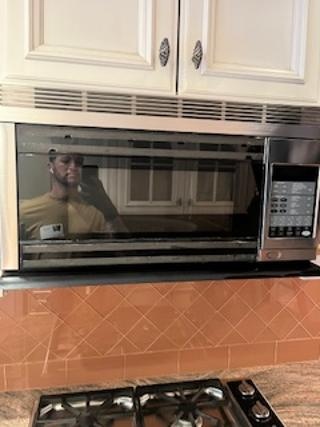 Wood-Mode Wonder: Traditional Light Cream Kitchen with Granite Countertops