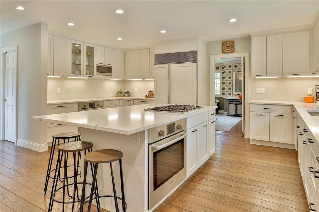 “The Westerly” Transitional White Kitchen with Island, 48" Sub-Zero Refrigerator and Bosch Appliances