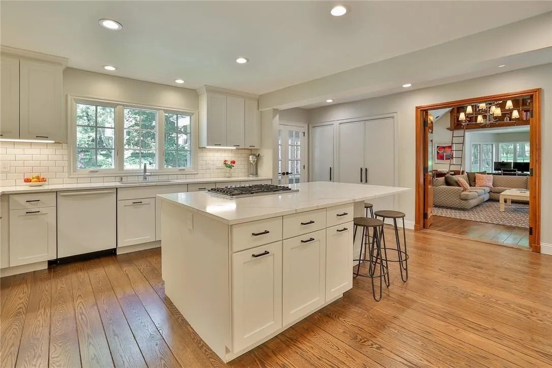 “The Westerly” Transitional White Kitchen with Island, 48" Sub-Zero Refrigerator and Bosch Appliances