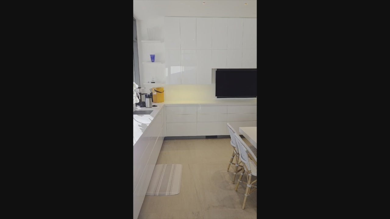 Load video: Custom Modern White Gloss Kitchen with Island, Stone Countertops and 60" Wolf Range