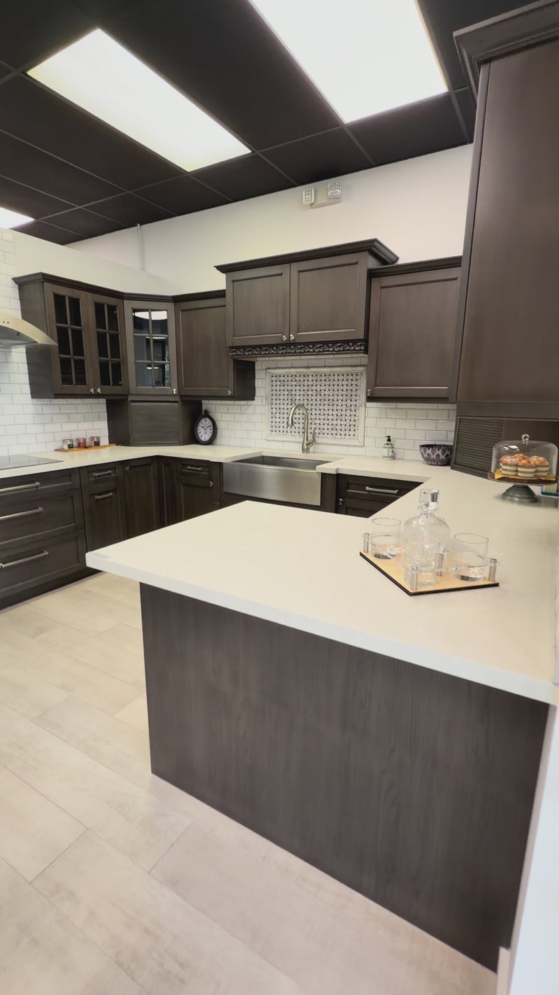 Kitchen Kraft transitional maple kitchen display with GE Monogram appliances