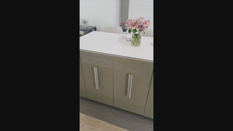 Luxury minimalist kitchen with large central island and integrated appliances by Rossana