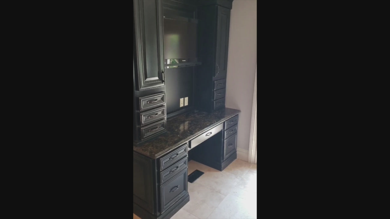 Load video: Luxury natural hardwood kitchen layout showing integrated desk office area and matching center island