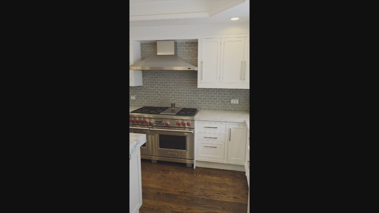 Load video: “The Clarendon” Transitional White &amp; Grey Kitchen with Island and Wolf Appliances