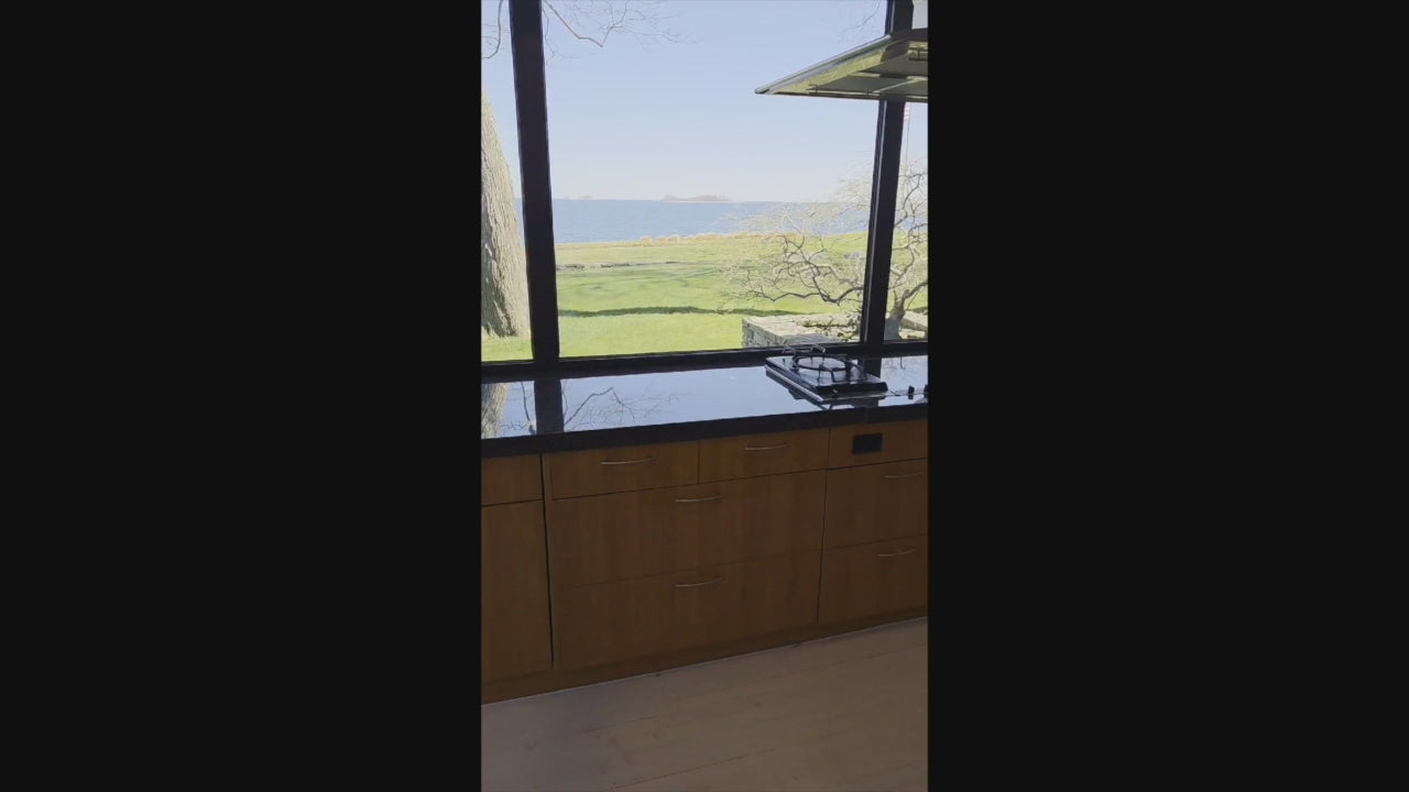 Load video: Neff modern kitchen set with 48 inch Viking refrigerator and matching island